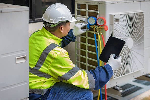 Professional Air Conditioning Repair technician working in Sharon, MA